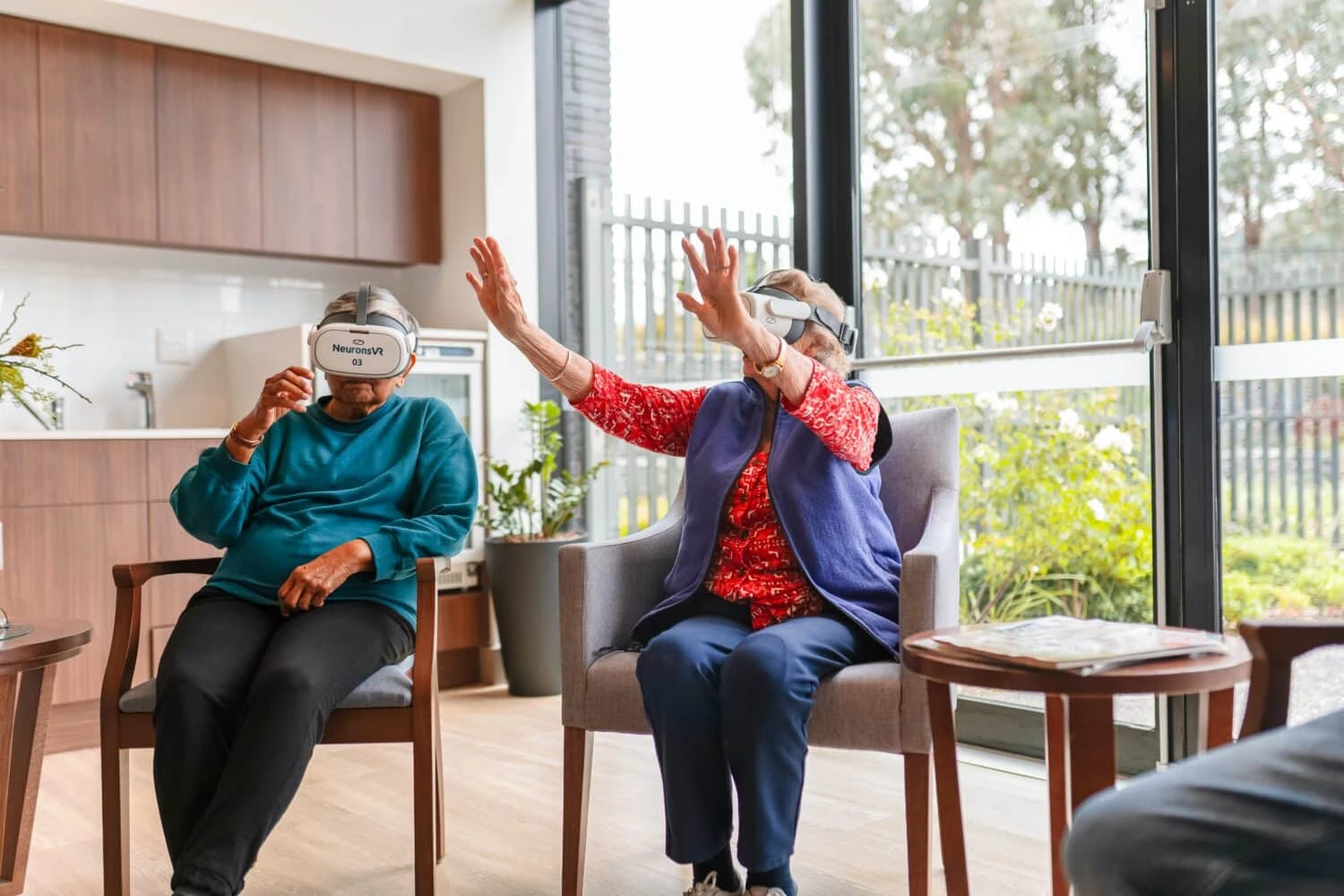 Person living with dementia using NeuronsVR VR therapy headset in aged care