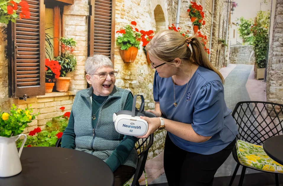 Staff using NeuronsVR with nursing home patients